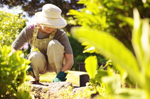 Gardeners in Noak Hill working on a well-kept residential garden